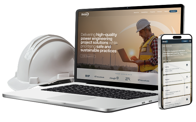 A white safety helmet, an open laptop displaying a power engineering company website, and a smartphone showing the same site’s mobile version are arranged on a white surface, highlighting innovation in the technology sector.