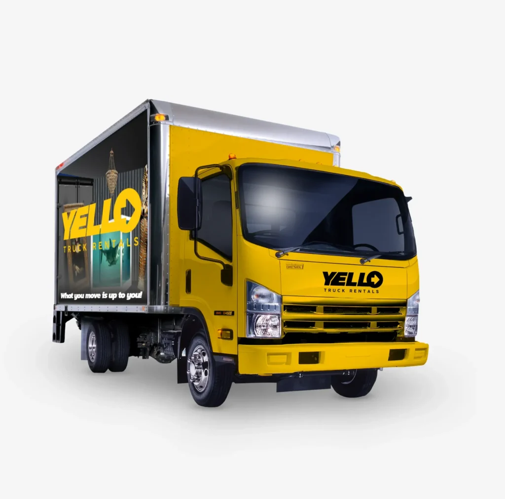 A yellow box lorry with Yello Truck Rental branding on the side and front is parked on a white background. The side panel features the slogan What you move is up to you! alongside an image of a lamp.