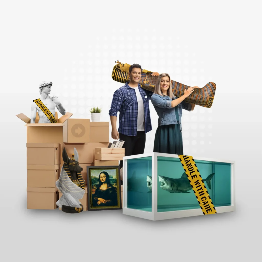 A smiling couple stands among cardboard boxes, holding an Egyptian sarcophagus. Surrounded by famous art replicas and a shark in a tank, their move with Yello Truck Hire feels like transporting a museum collection.