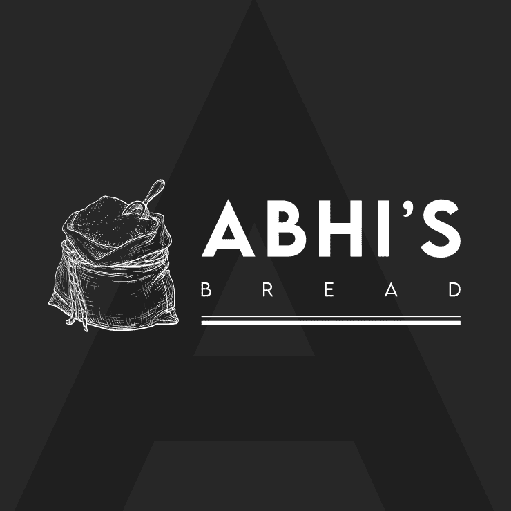 A minimalist logo featuring a sketch of a bread-filled sack and spoon, beside bold Abhi’s Bread text on a dark background, with a large, faint letter A behind the design.