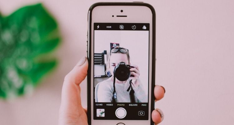 Content creation workspace showing camera, lighting equipment, and product styling for influencer marketing