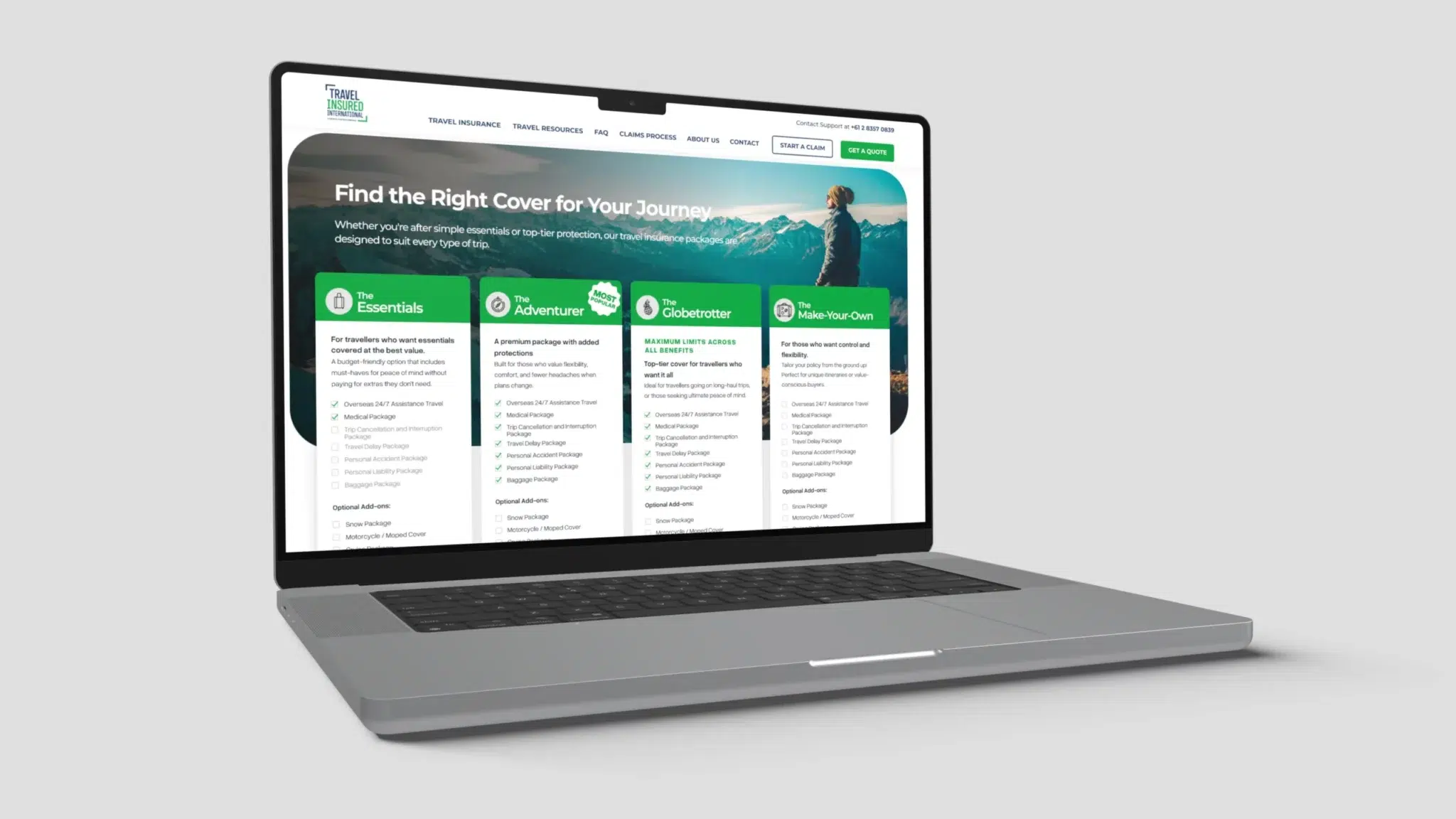A laptop on a grey surface displays a travel insurance website offering Essentials, Adventure, Globe-trotter, and customisable plans for insured travel, with a scenic mountain image in the background.
