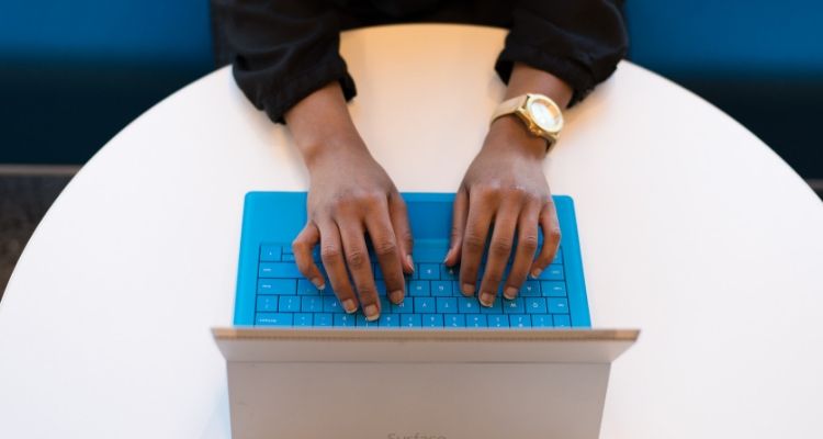 SEO analyst researching link building opportunities using analytics tools and spreadsheets