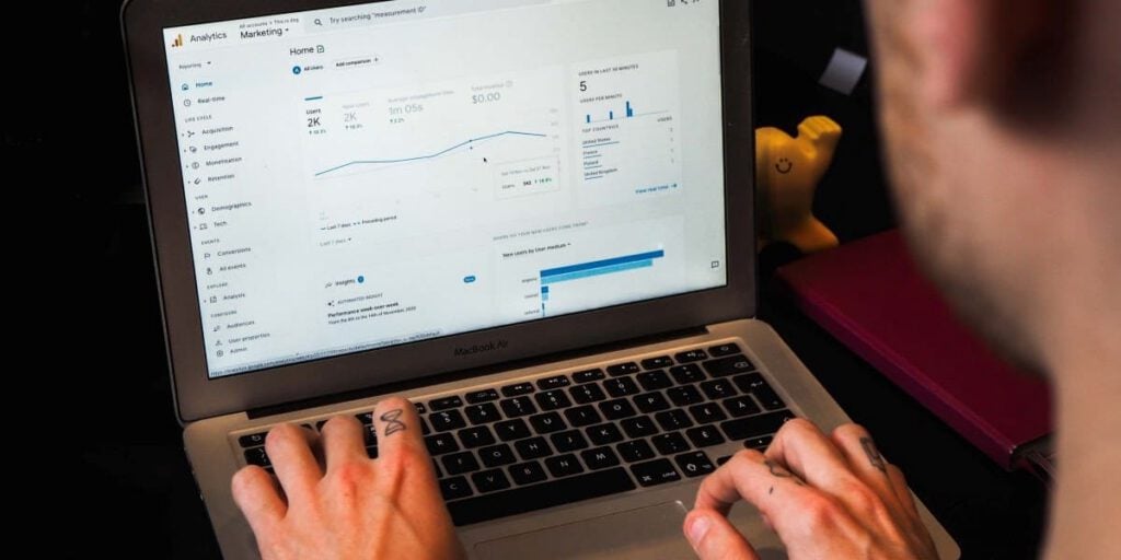 Google Analytics 4 dashboard on a laptop