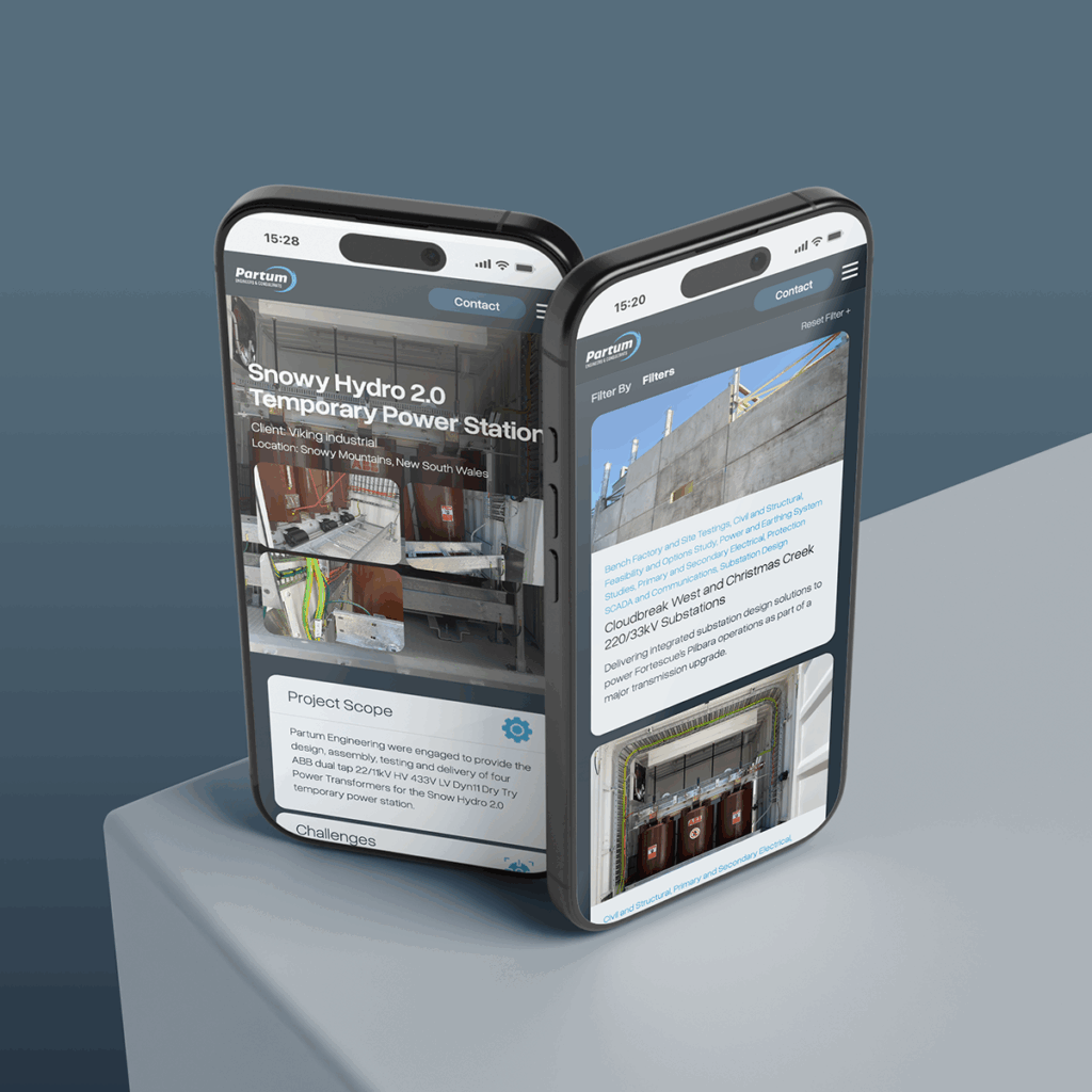 Two modern smartphones display a construction project webpage by Partum Engineering titled Snowy Hydro 2.0 Temporary Power Station, featuring images and project details. The phones are positioned on a grey surface.