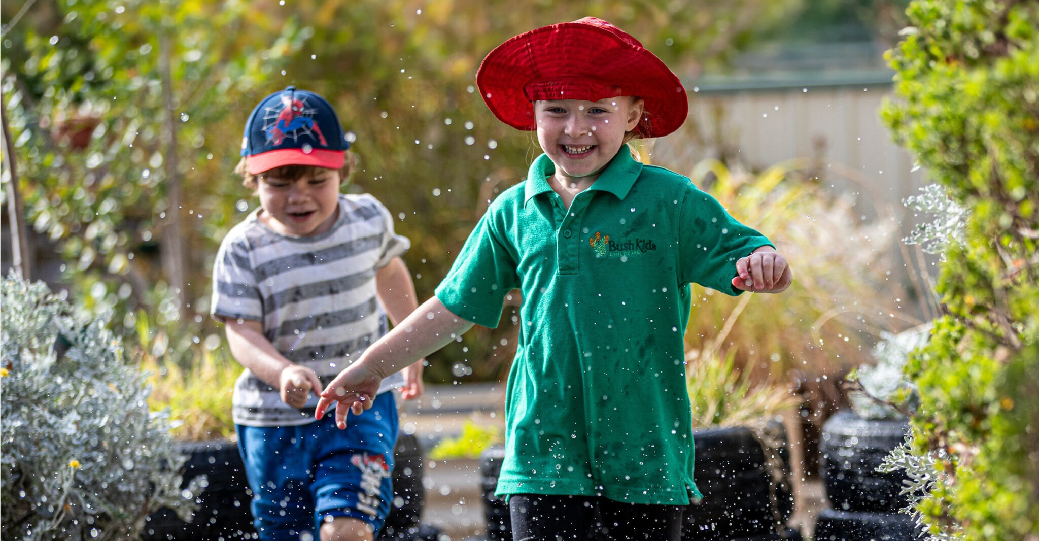 Children playing in water outdoors